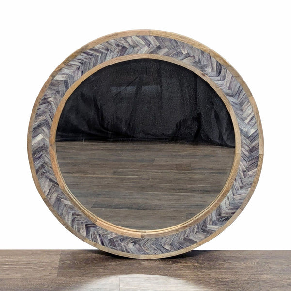 1. Round Reperch mirror with a chevron-patterned wood frame, displayed on a wooden floor, from the Mirror category.