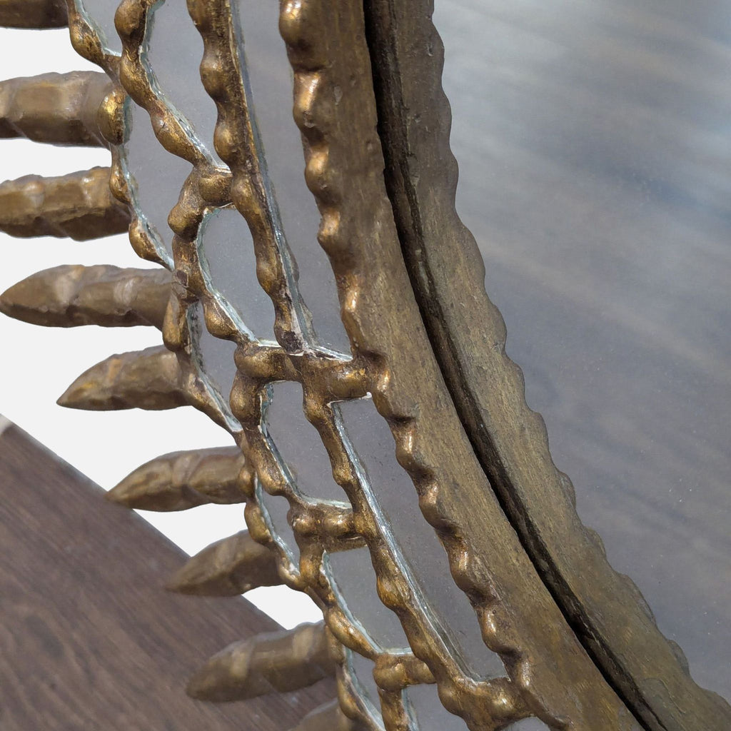 2. Close-up of the Reperch mirror’s giltwood frame, showing intricate detailing and bronze-colored pointed accents.