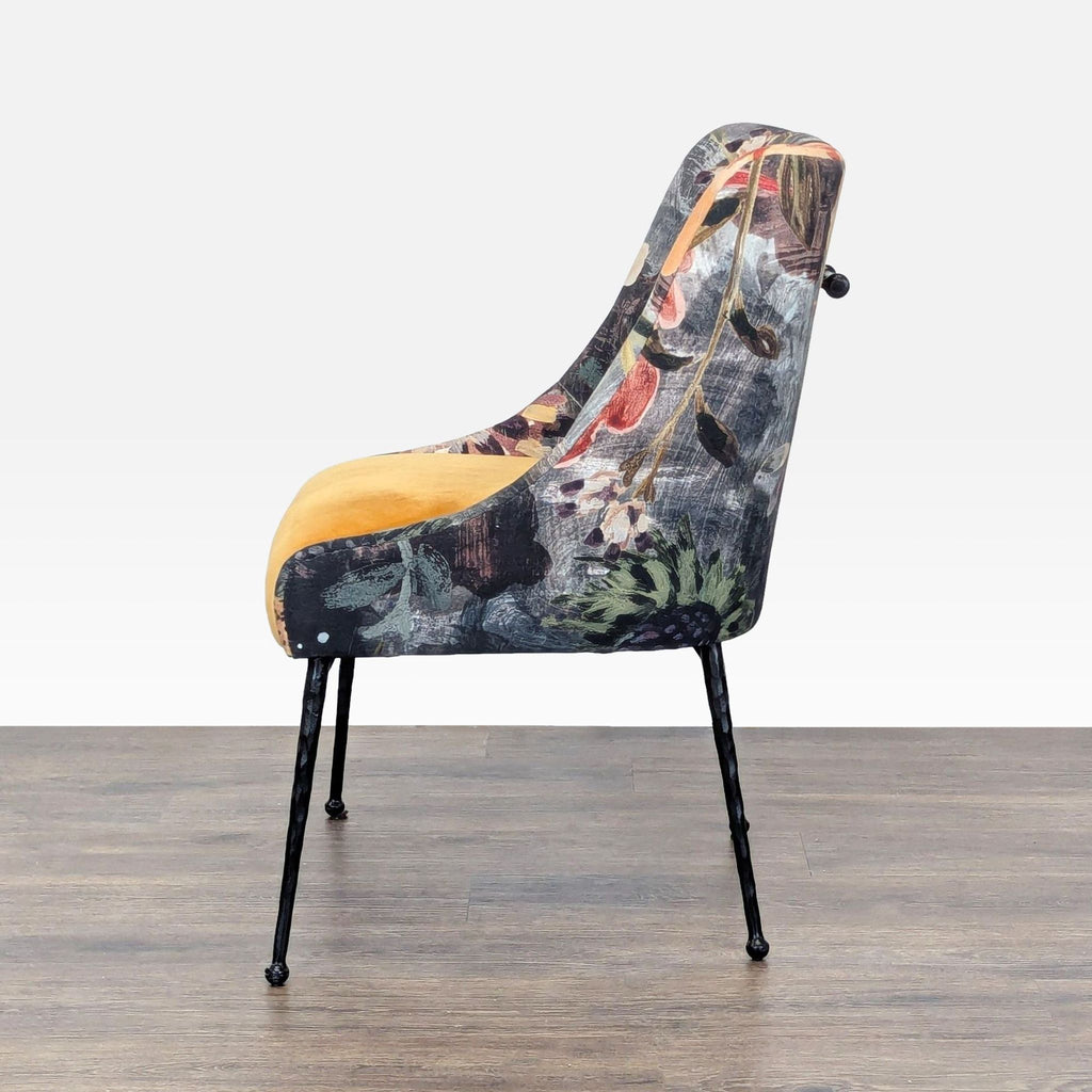Side profile of the Anthropologie lounge chair showing the mix of yellow velvet and unique floral and swan fabric.