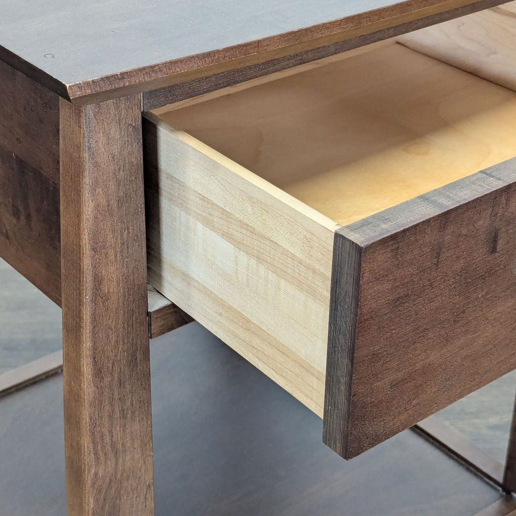 1. Close-up of a Baronet end table showing an open light wood drawer with a dark brown stained frame.