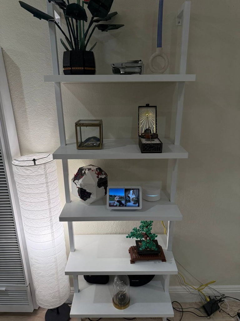 1. Decorated Nathan James Theo 73" 5-Shelf white ladder bookcase with plants, gadgets, and decorative items.