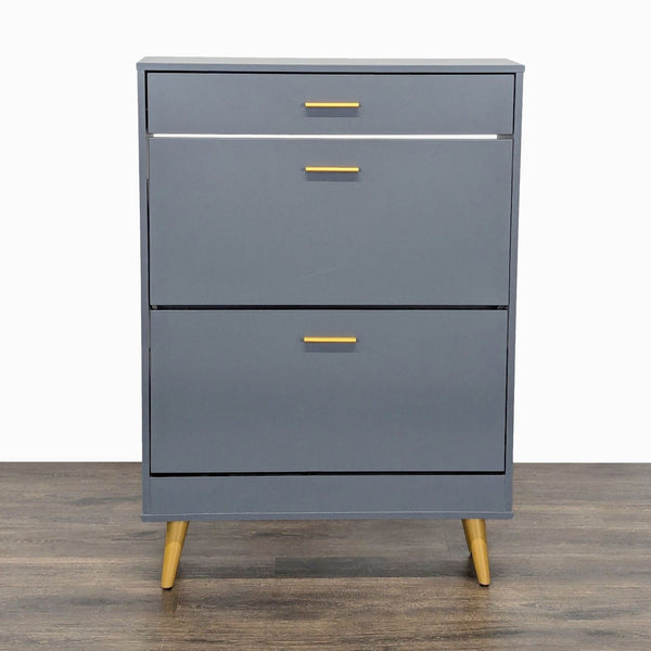 1. Everly Quinn gray cabinet with gold handles and legs, featuring a modern, minimalist design on wood flooring.