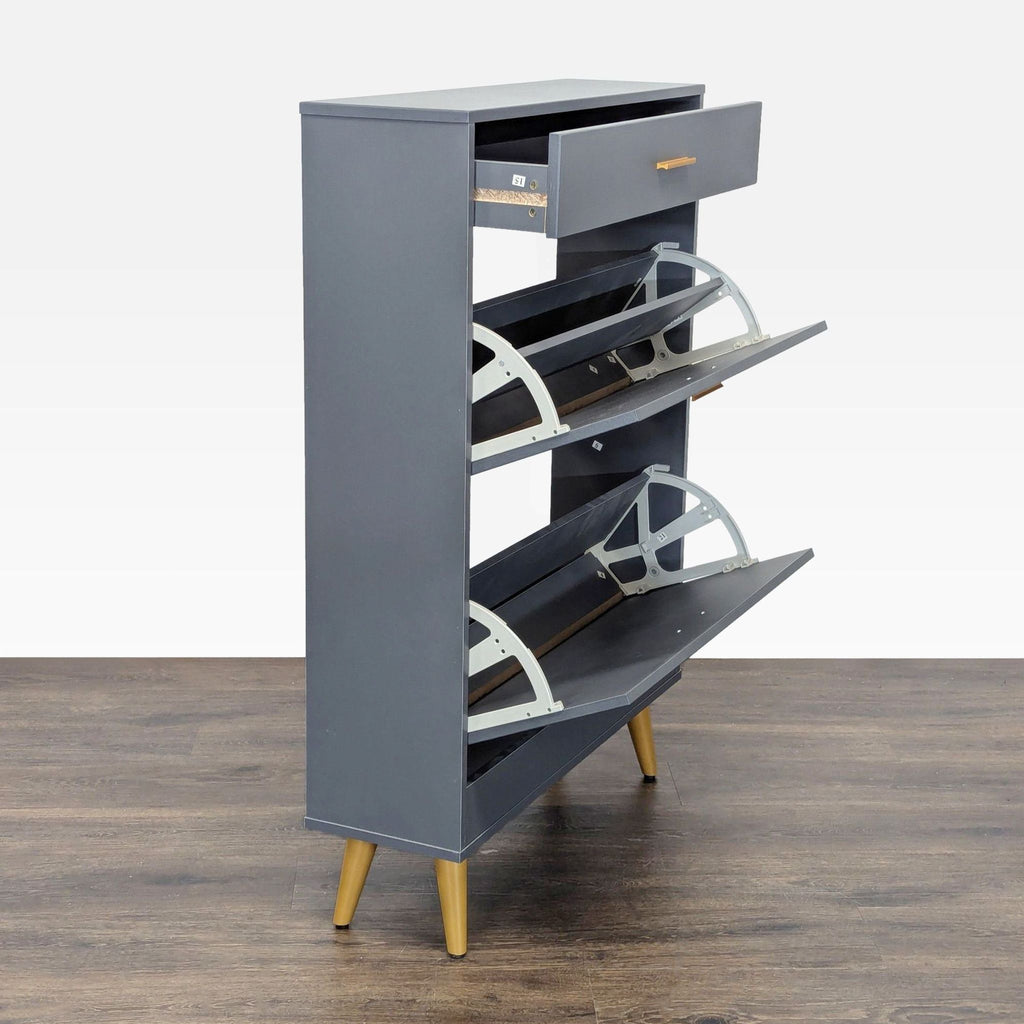 2. Side view of Everly Quinn gray cabinet showing open drawer and two open tilt-out compartments, gold handles and legs.