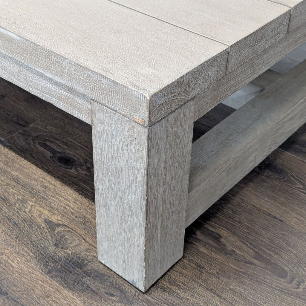 2. Close-up of a Reperch table corner, highlighting the sturdy leg and textured wood grain in a light finish.