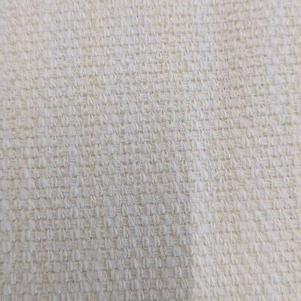 1. Close-up of a beige woven fabric upholstery featuring a textured, grid-like pattern.