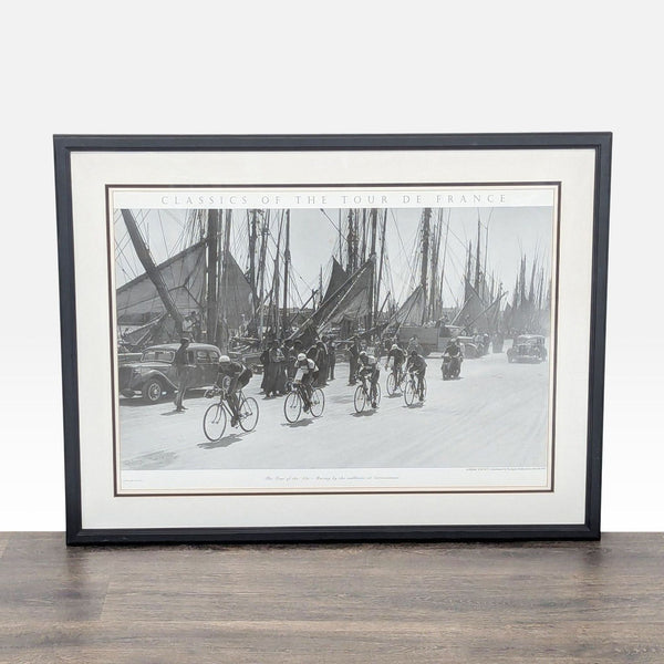 1. Framed Art.com print showing vintage cyclists racing past sailboats and old cars, black and white, Tour of the '30s.  