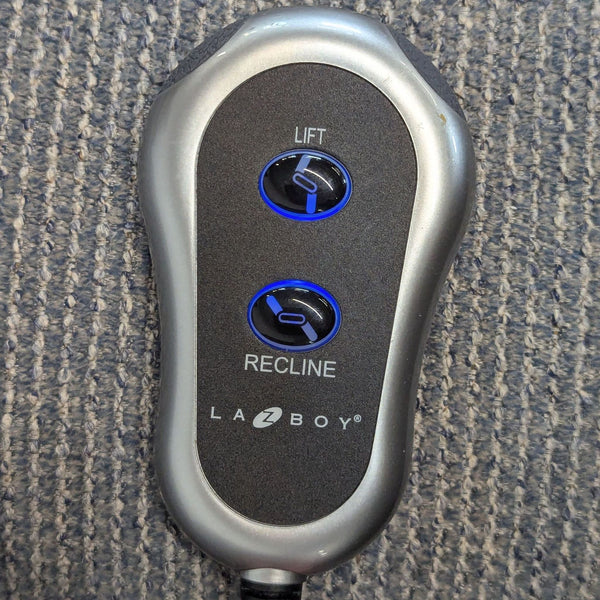 1. La-Z-Boy lounge chair remote with lift and recline buttons on textured carpet background.