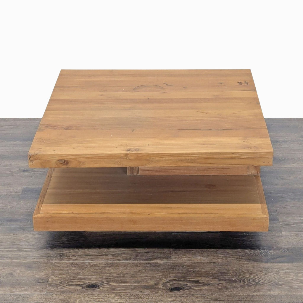 1. Square wooden Reperch coffee table with a floating shelf design, shown on a dark wood floor.  