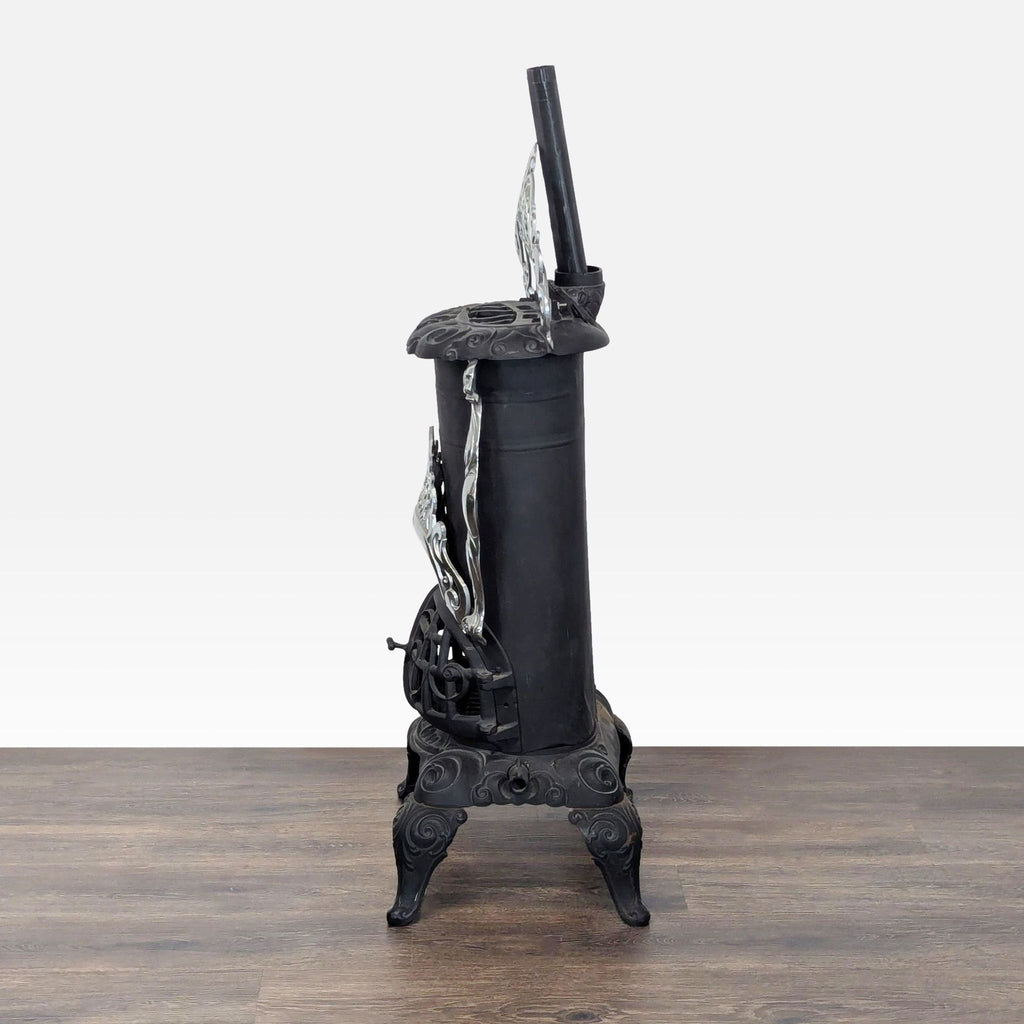 3. Side view of the Reperch cast iron parlor stove, featuring curved legs and intricate nickel-plated detailing.