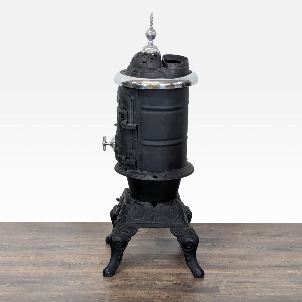 Antique Iron Parlor Stove with Decorative Silver Accents