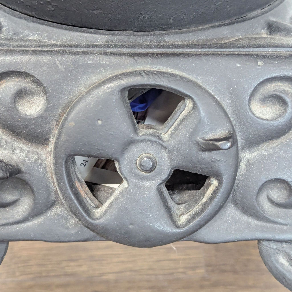 Antique Iron Parlor Stove with Decorative Silver Accents