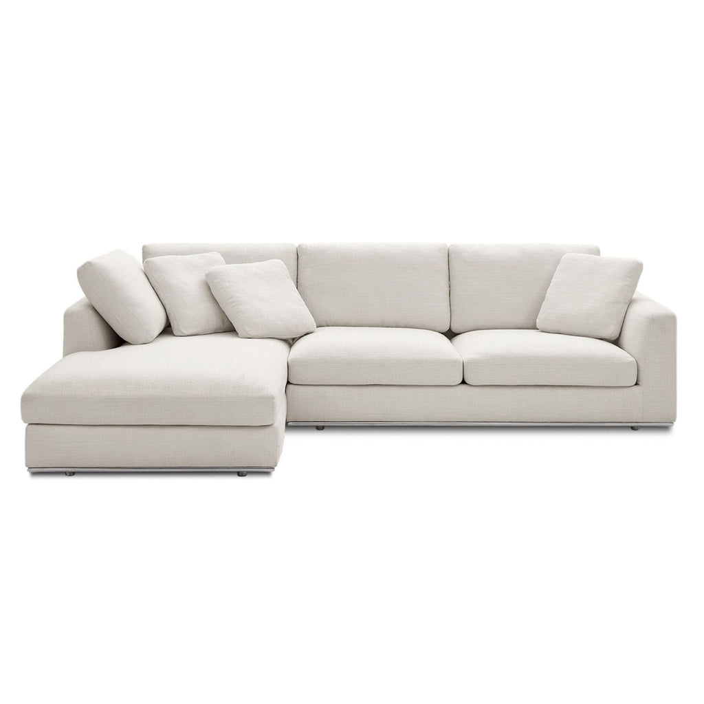 1. Castlery sectional sofa in light beige fabric with chaise lounge and matching cushions, modern and spacious seating.  