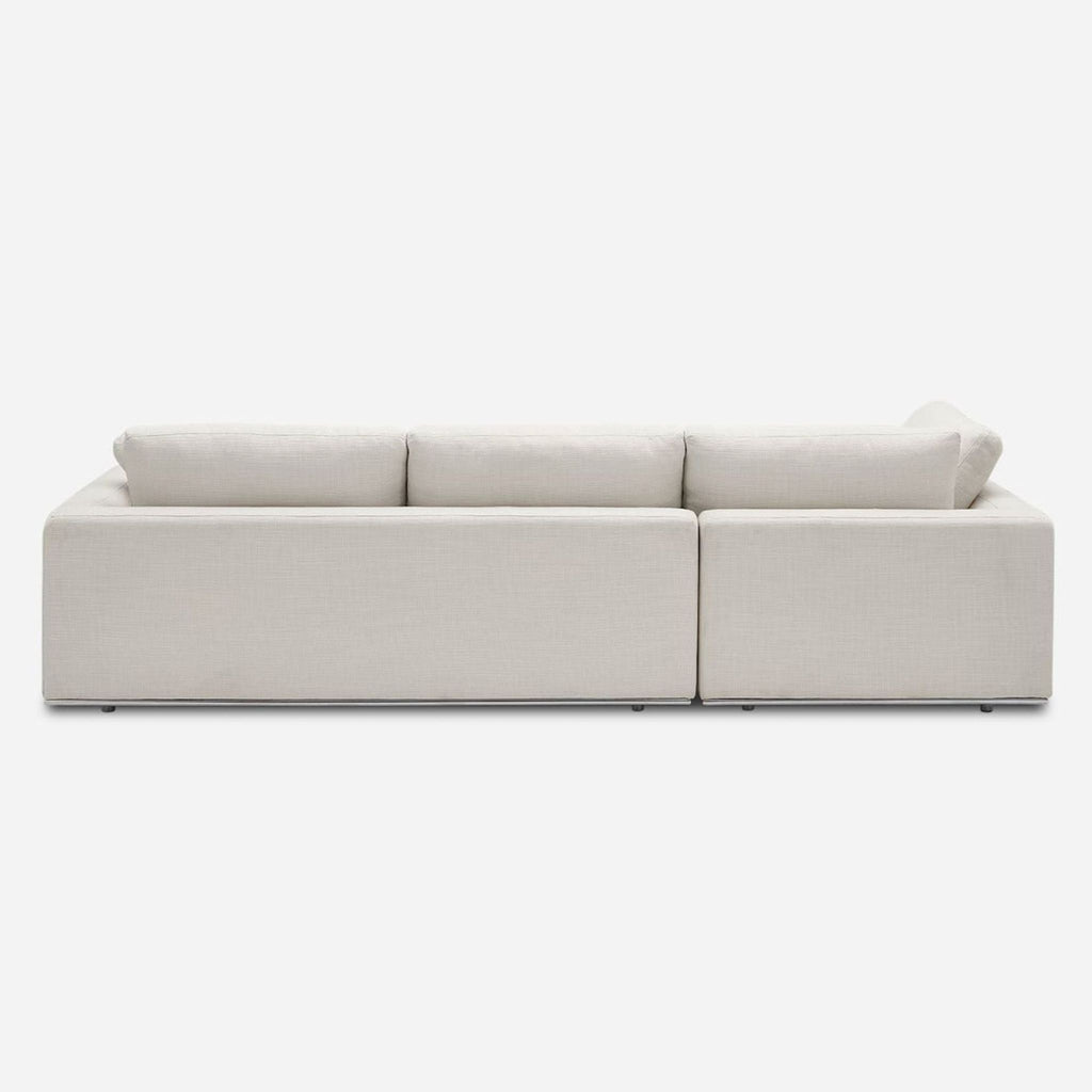 3. Back view of a light beige Castlery sectional sofa with a sleek and clean-lined modern design.