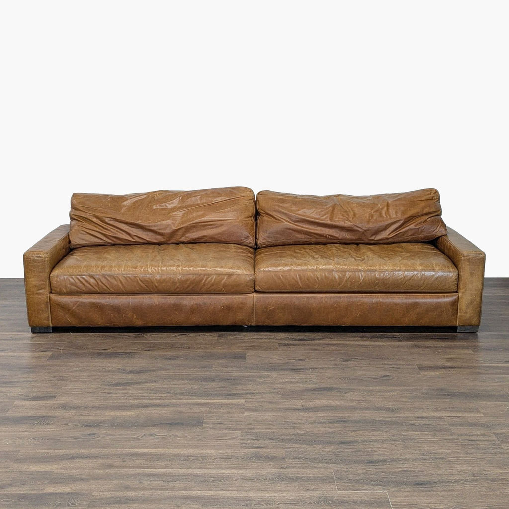 1. Restoration Hardware 3-seat sofa with distressed brown leather, deep seats, and plush cushions for classic comfort.