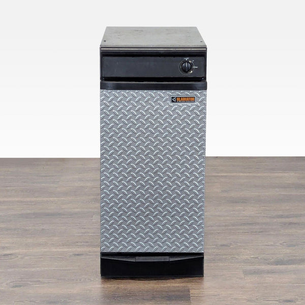 1. Front view of a Gladiator trash compactor with diamond plate panel and a black metal body, perfect for garages.