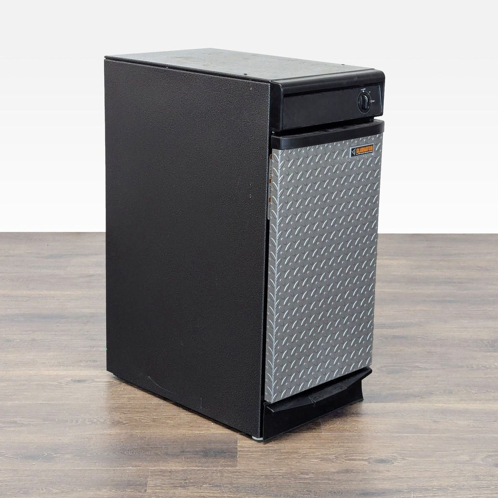 2. Angled side view of a sturdy black Gladiator trash compactor featuring a rugged diamond plate front panel.