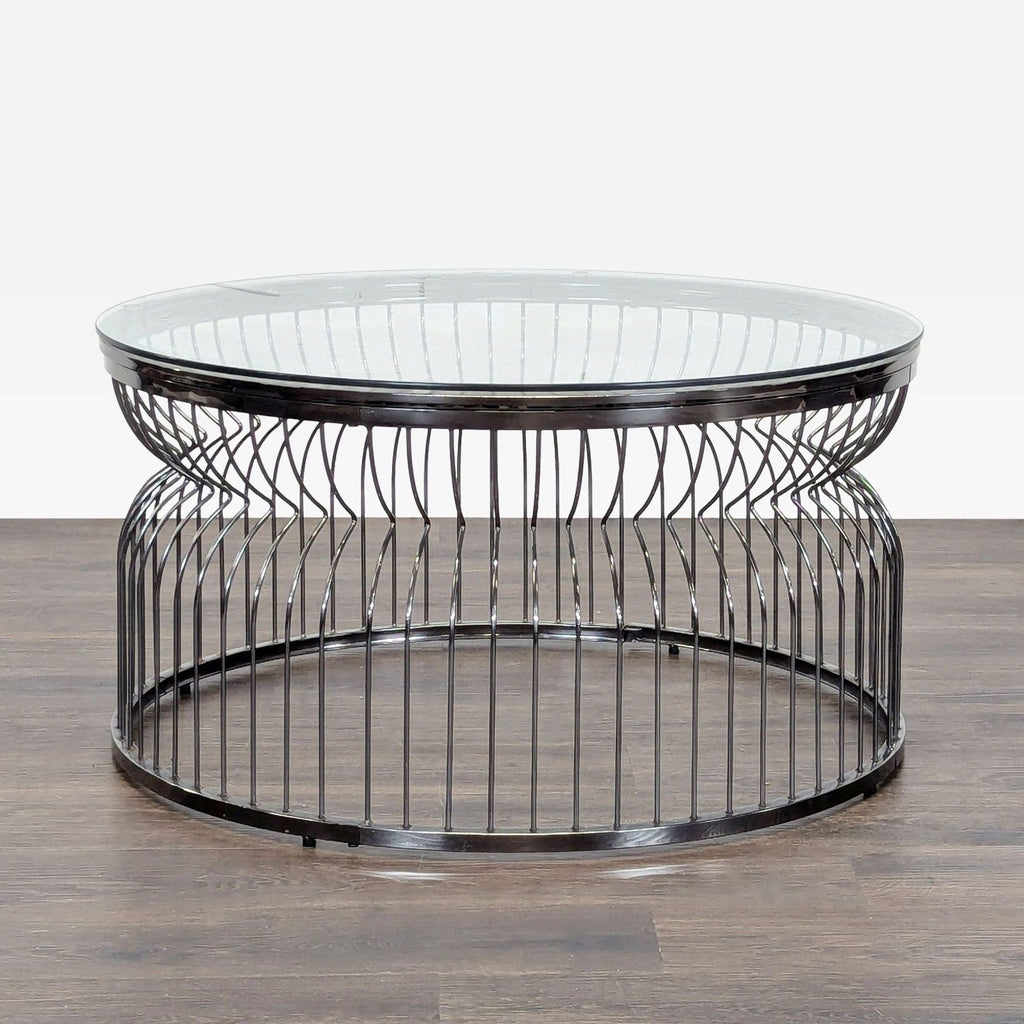 1. Reperch round coffee table with a glass top and metal wire base, shown on a dark wood floor.