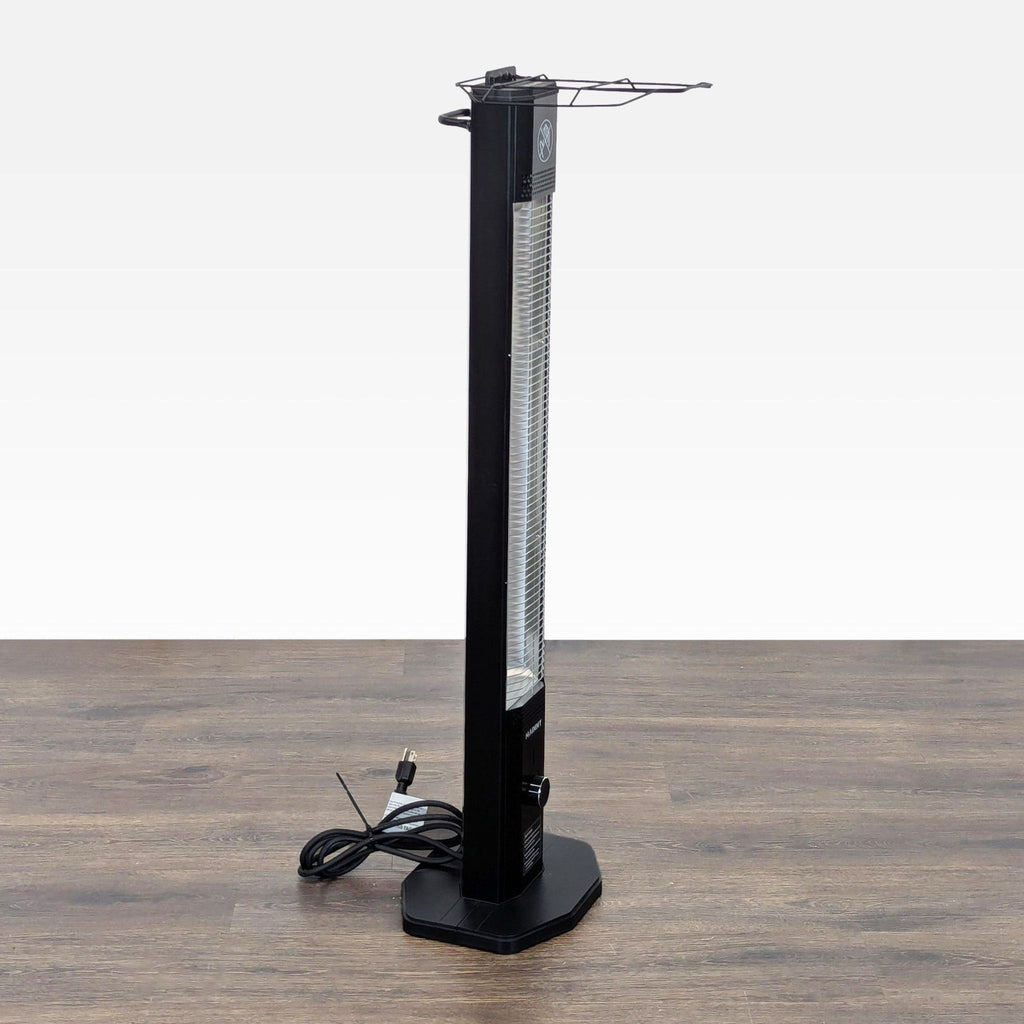 2. Side view of the Haimmy electric tower heater showing its space-saving profile, power cord, and sturdy base.