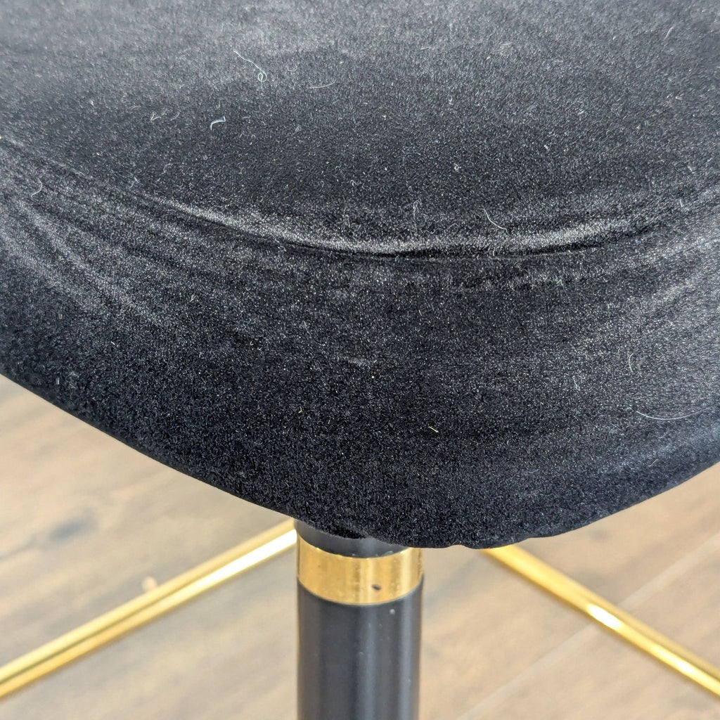 2. Close-up of the plush black seat cushion texture on a Reperch stool from the Stools, Ottomans & Benches category.