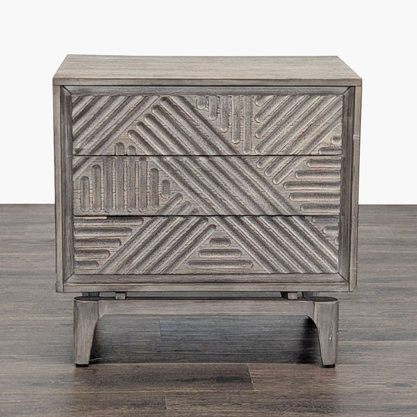 Front view of Coaster end table featuring two textured drawers and a modern, geometric design.