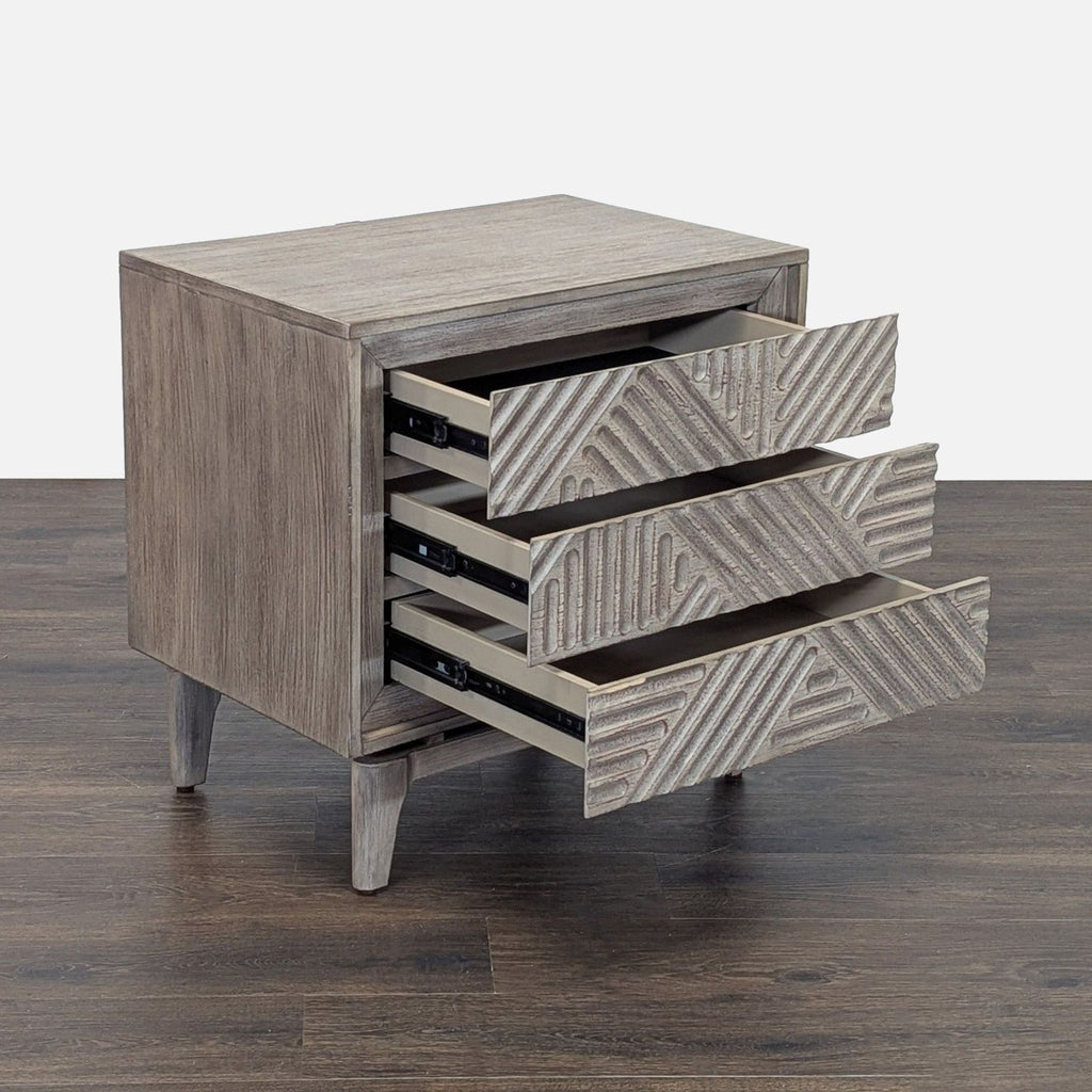 Side angle of Coaster end table showing all three textured drawers open, highlighting spacious storage.