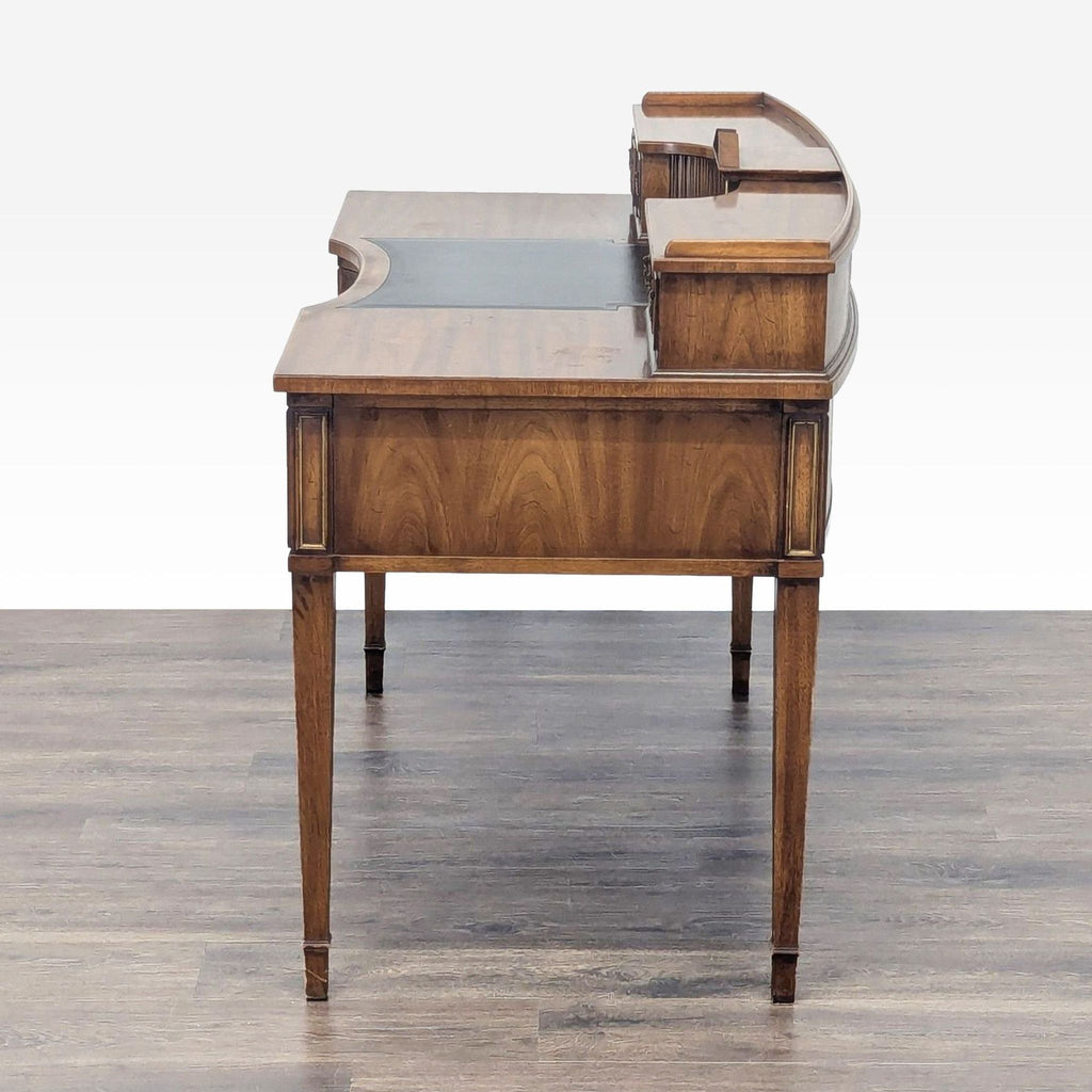 3. Side view of Reperch wooden desk highlighting its sturdy build, elegant shape, and raised back section with clock.