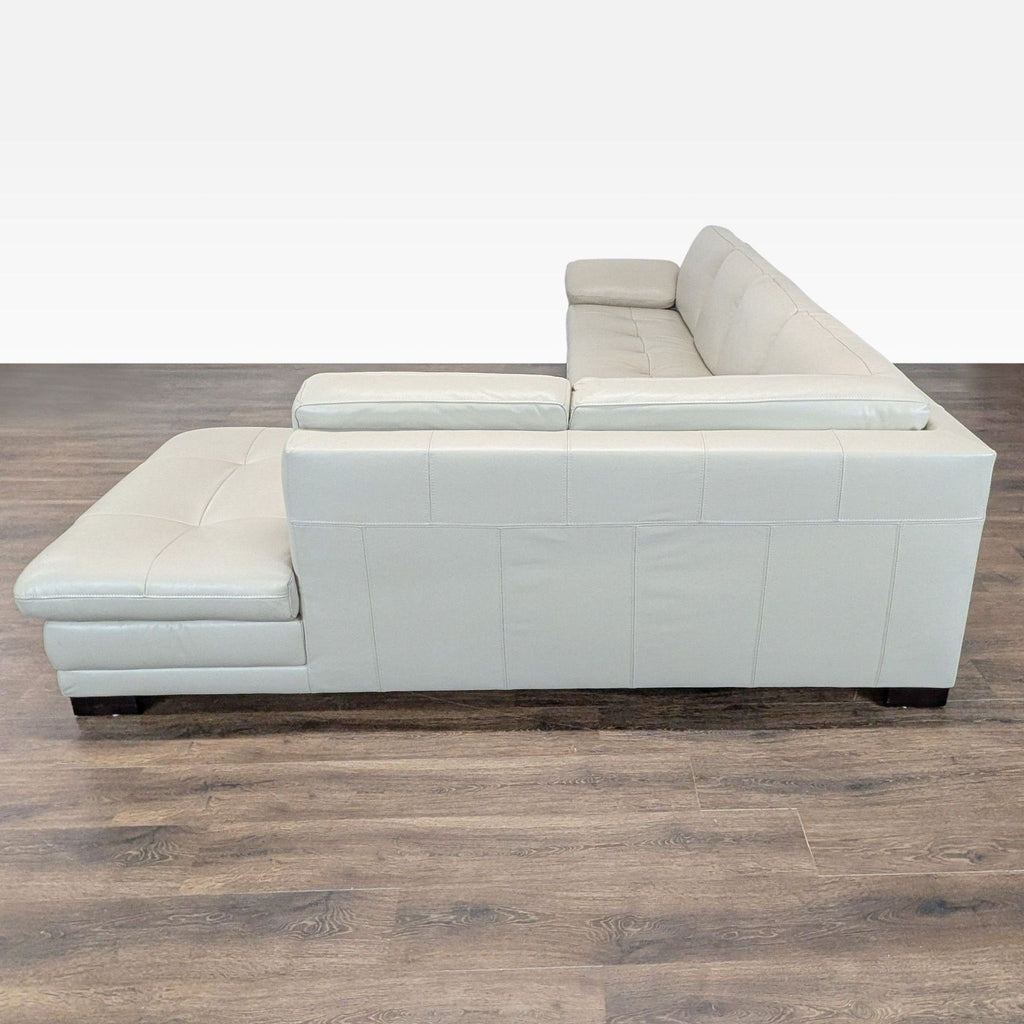 Scandinavian Designs sectional sofa in light gray leather with a roomy L-shape and comfortable, contemporary design.