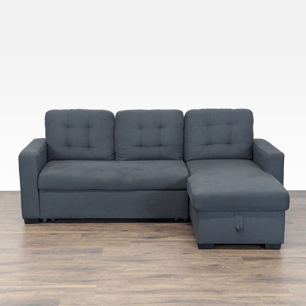 1. Dark gray Ana Furniture sleeper sofa with tufted cushions and right-side storage chaise on wood floor.