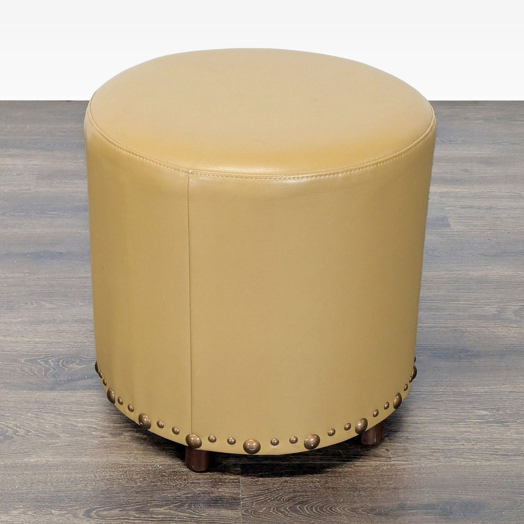 Upholstered Ottoman with Nailhead Trim
