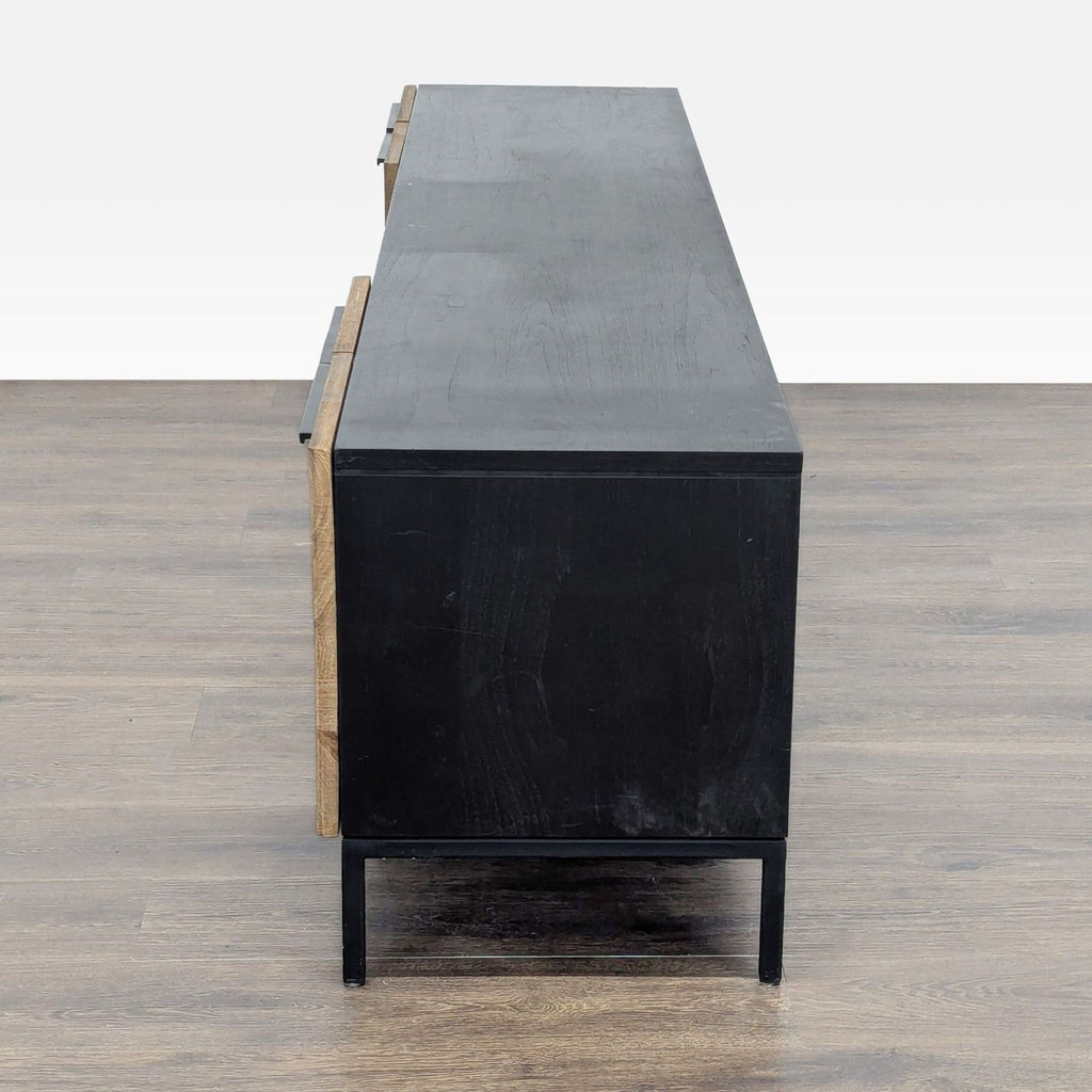 3. Side profile of Crate & Barrel solid teak and black steel entertainment center, highlighting sleek design.