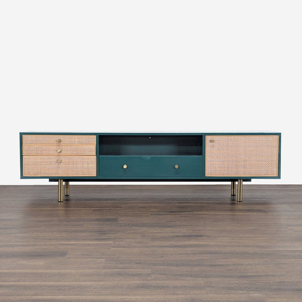 1. Mid-century style Anthropologie entertainment center with rattan drawers, brass legs, and bold veneer front.