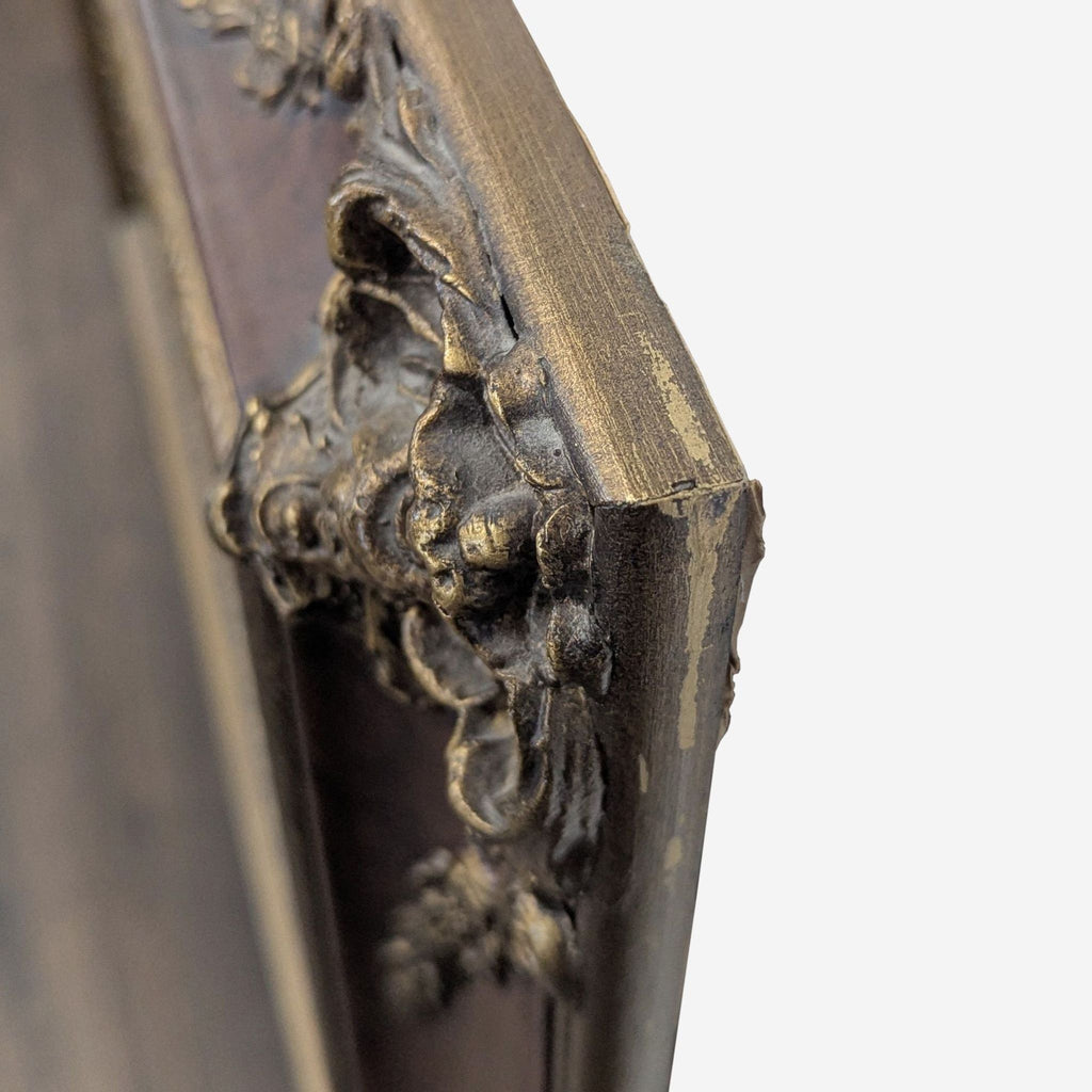 2. Close-up of the Reperch mirror's corner, showing intricate gold embellishments and visible wear on the frame.  