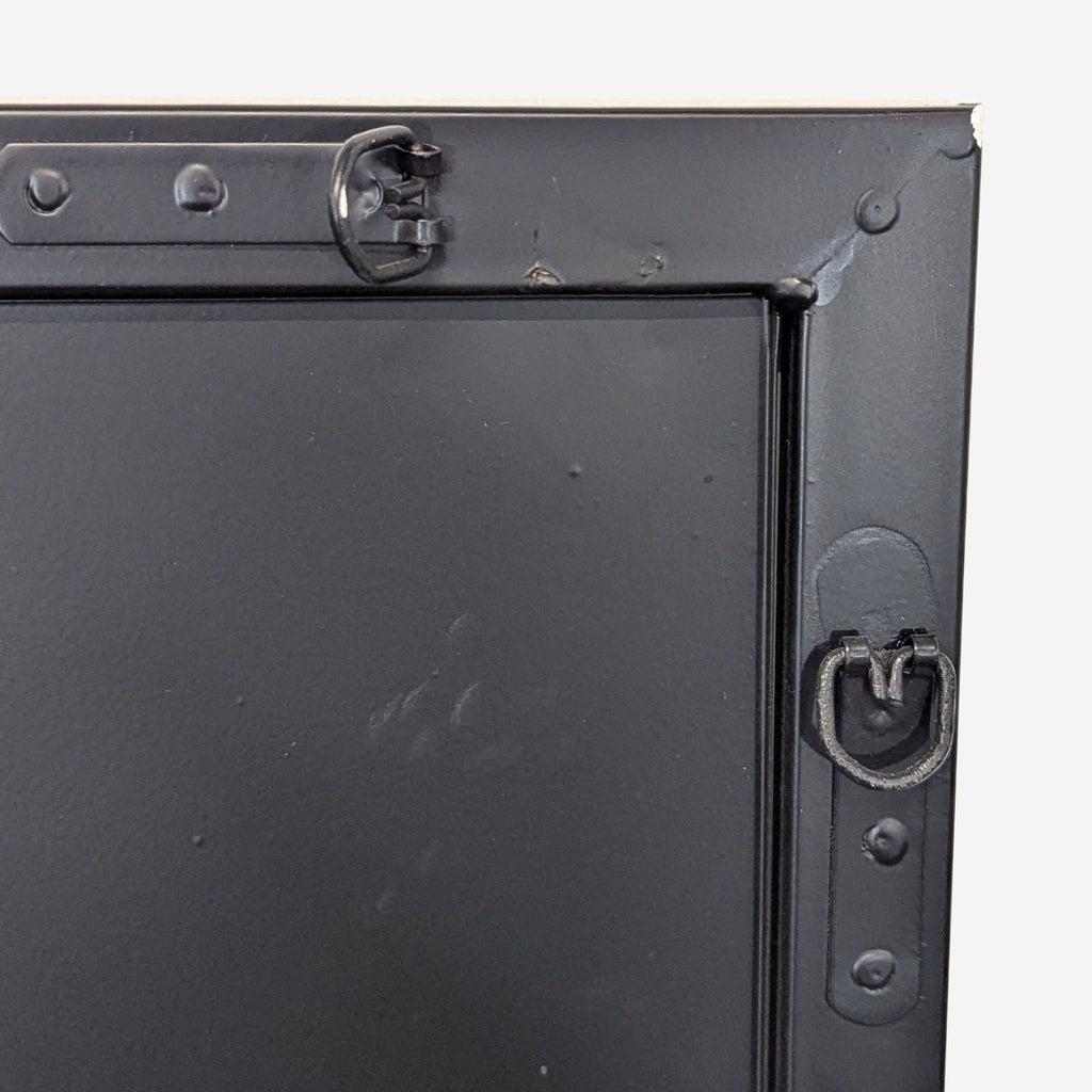 3. Close-up of the back corner of a Reperch mirror, showing metal hanging hardware and sturdy construction.