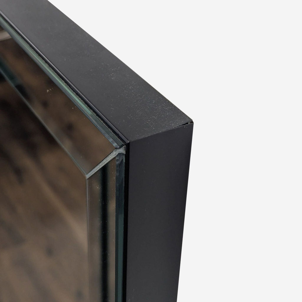 2. Close-up of the Coaster mirror’s sleek beveled silvered edge, highlighting the detailed frame construction.