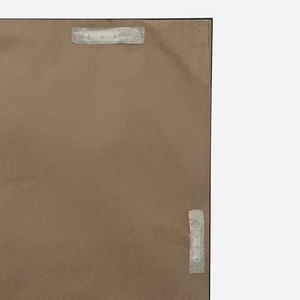 3. Back side of the Coaster mirror, showing the brown paper backing and mounting hardware attached.