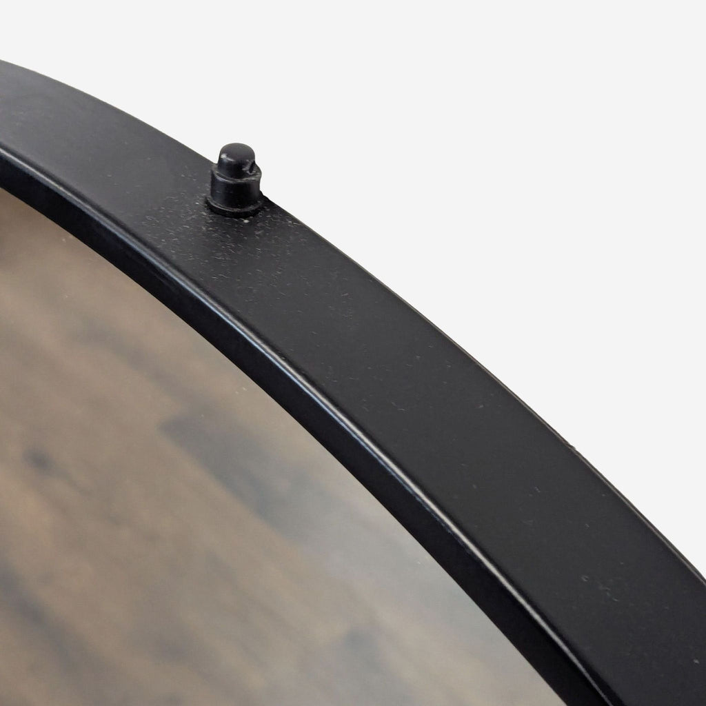 3. Detailed view of the Reperch mirror's top, highlighting the black frame and attachment knob.