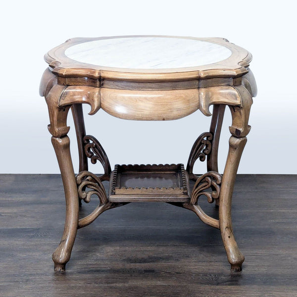 1. Ornate wooden Reperch end table with a round marble top and decorative lower shelf, shown against a pale background.  