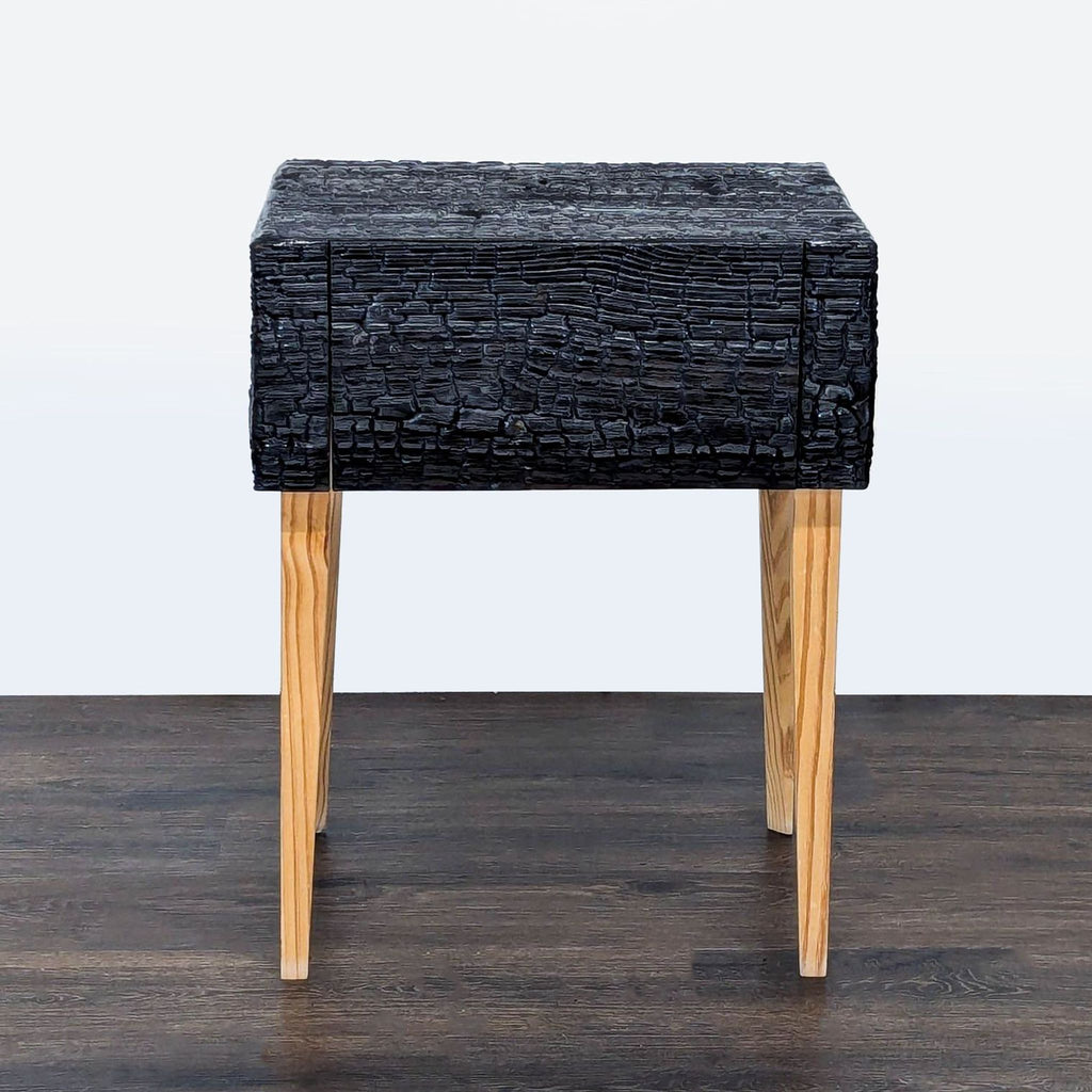 Modern black charred Loblolly Pine end table by Reperch with mitered edges and slender natural wood legs.