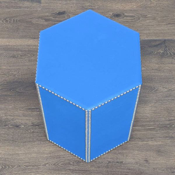 1. Hexagonal blue side table by Restoration Hardware with metallic nailhead trim, shown on a wood floor.  