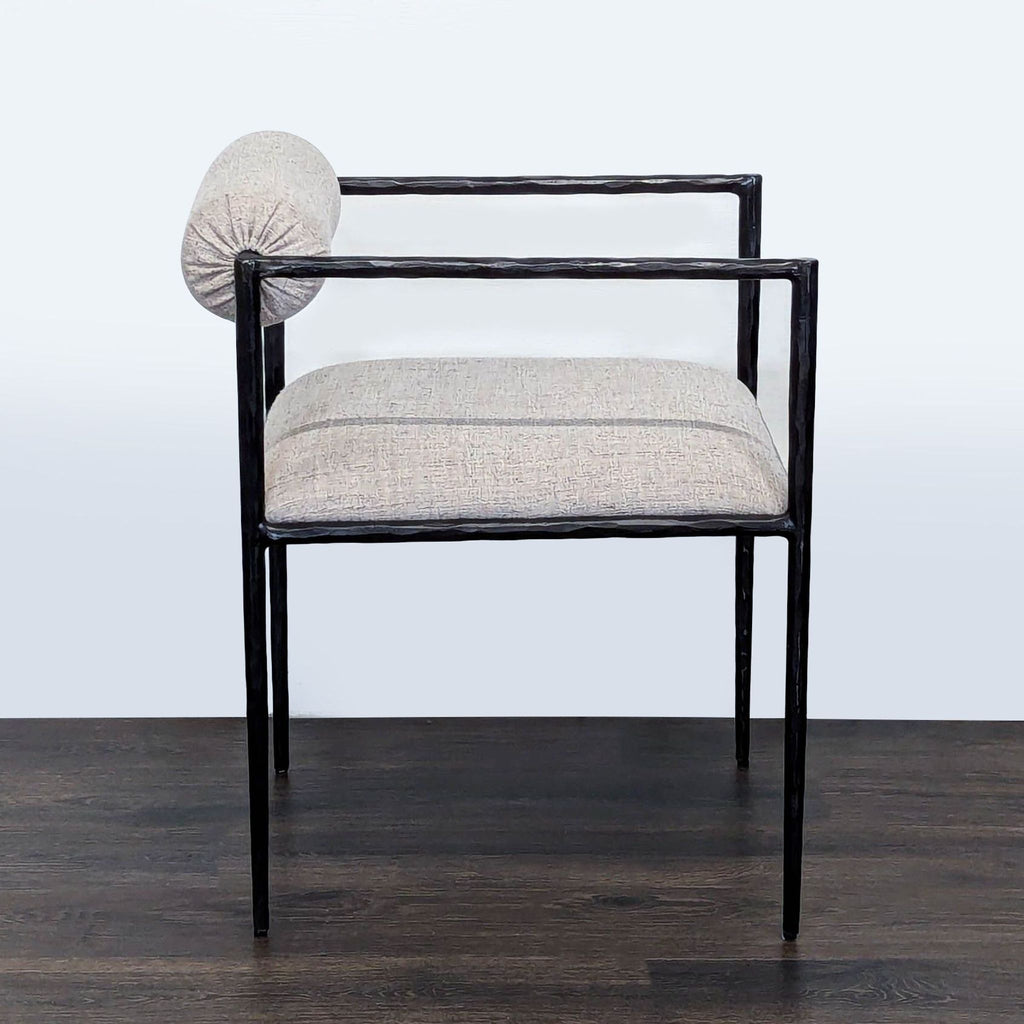 3. Side view of Pewter dining chair with an upholstered seat and distinctive rolled backrest.