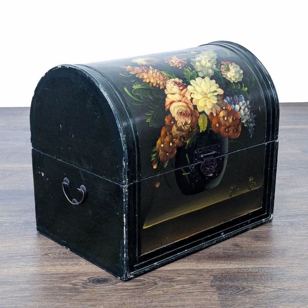 2. Angled view of a Reperch trunk in the Trunk category, featuring hand-painted flowers and metal side handles.  