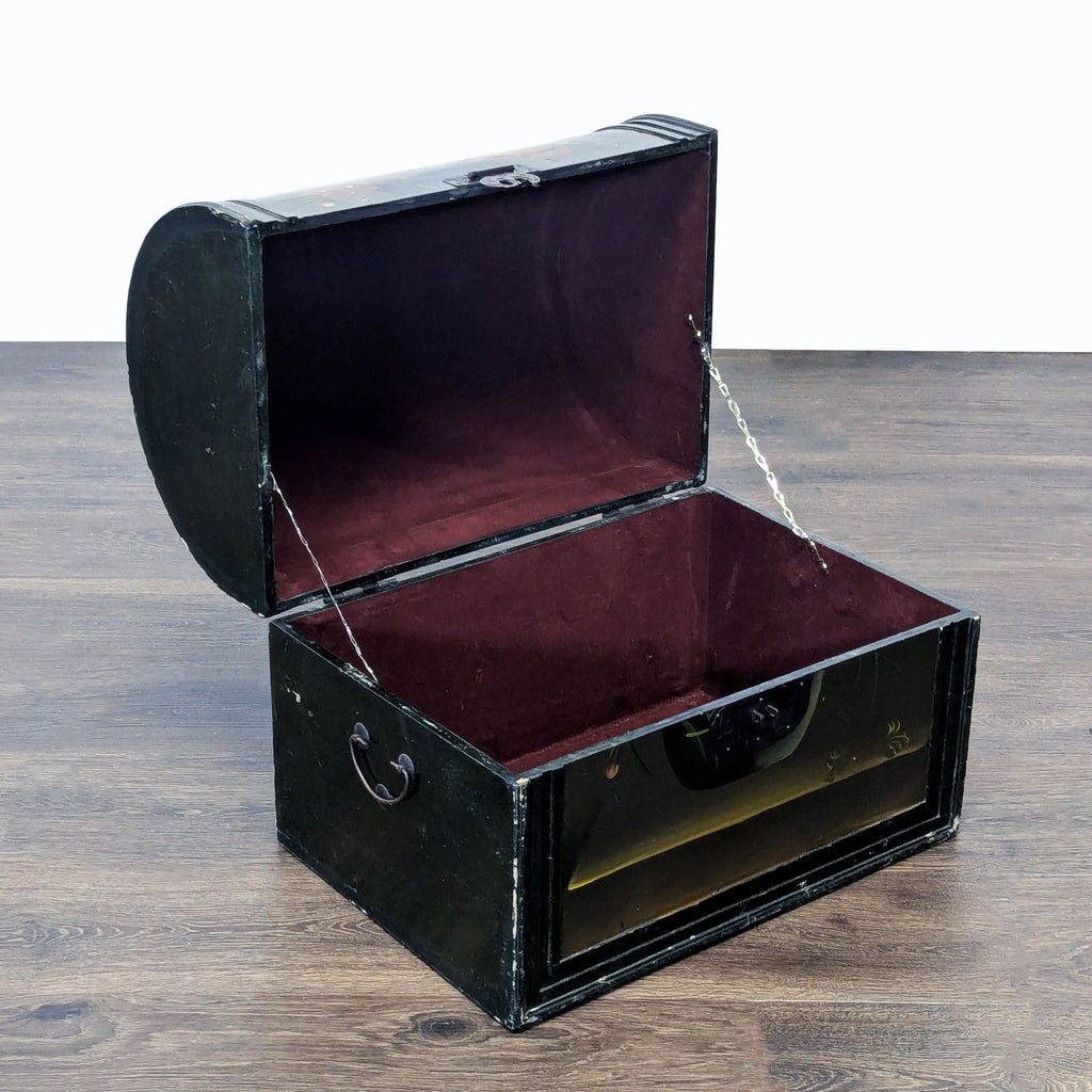 3. Open Reperch trunk showing maroon velvet-lined interior, black exterior, and detailed floral artwork on the lid.