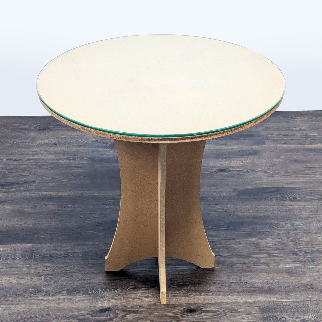 2. Reperch brand round end table featuring a glass surface and sculpted wood support, displayed on wood flooring.  