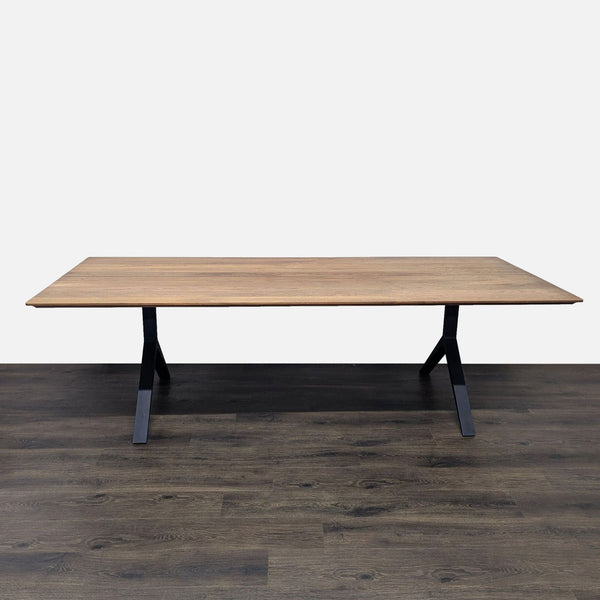 1. Rectangular walnut dining table with a sleek solid wood top and black anodized aluminum legs from De La Espada.