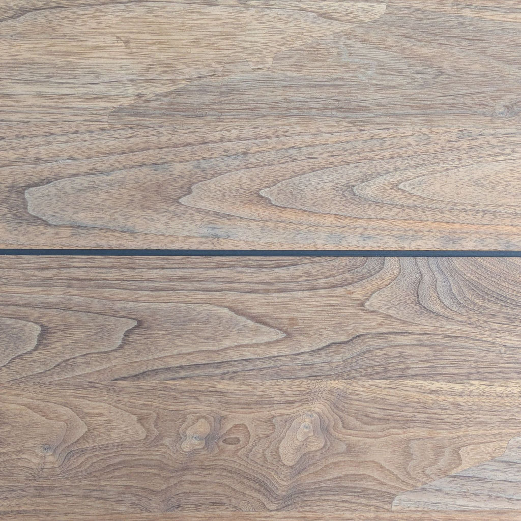 3. Close-up of the De La Espada dining table’s wood grain, displaying natural patterns on the tabletop.