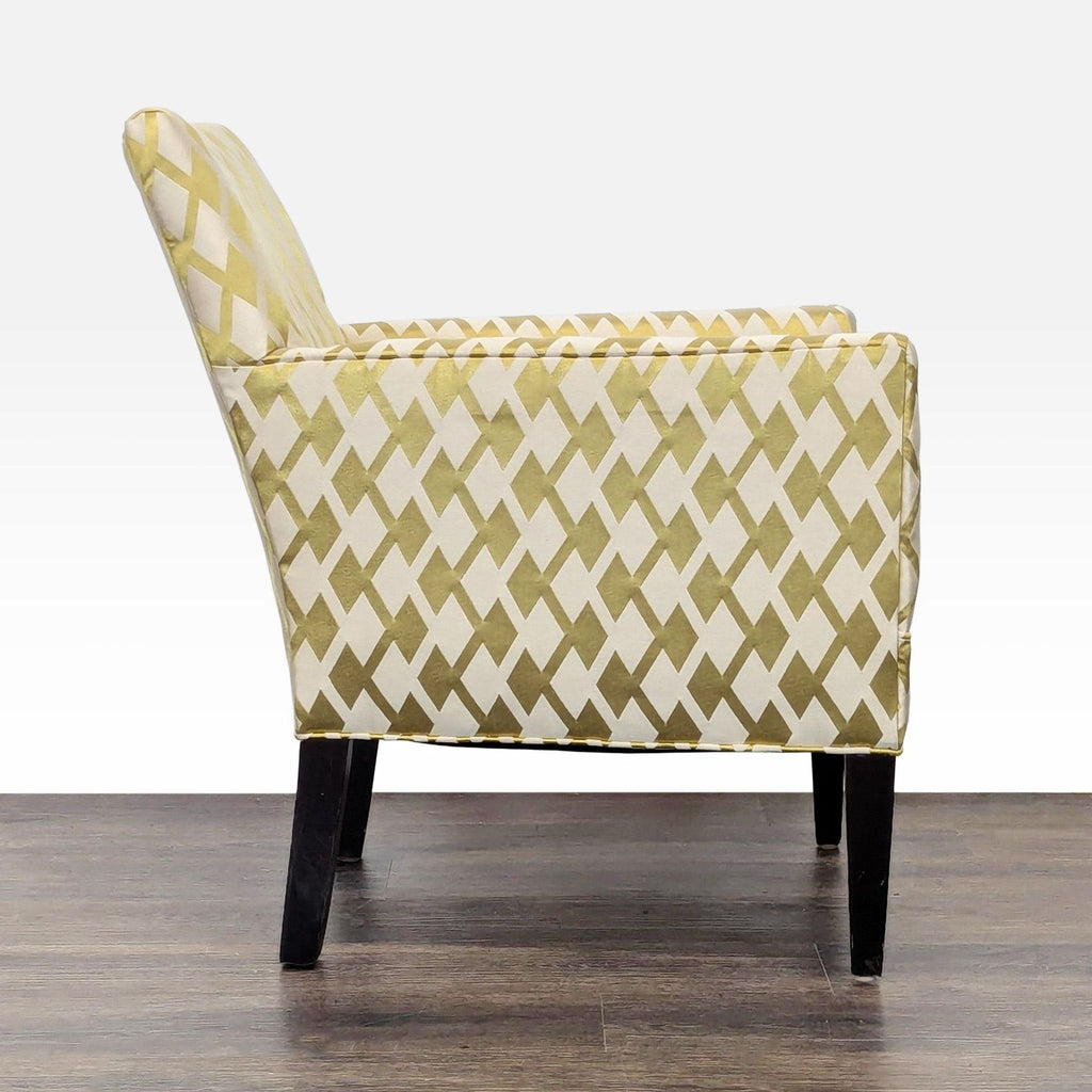 Side profile of a lounge chair by Lee Industries, featuring bold gold and cream geometric upholstery and slim arms.