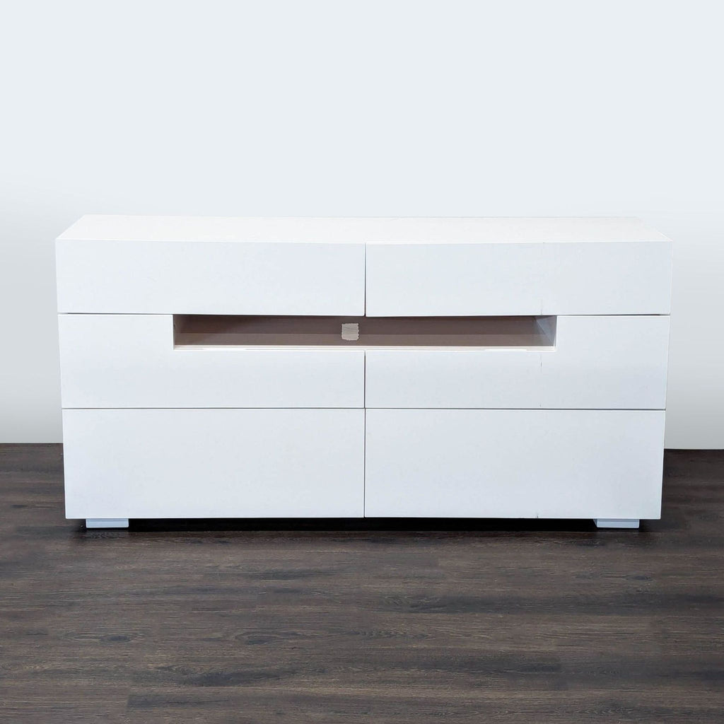 1. Reperch entertainment center in glossy white with six drawers and a central open shelf, viewed from the front.