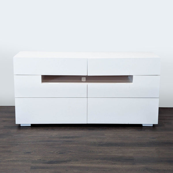 1. Reperch entertainment center in glossy white with six drawers and a central open shelf, viewed from the front.