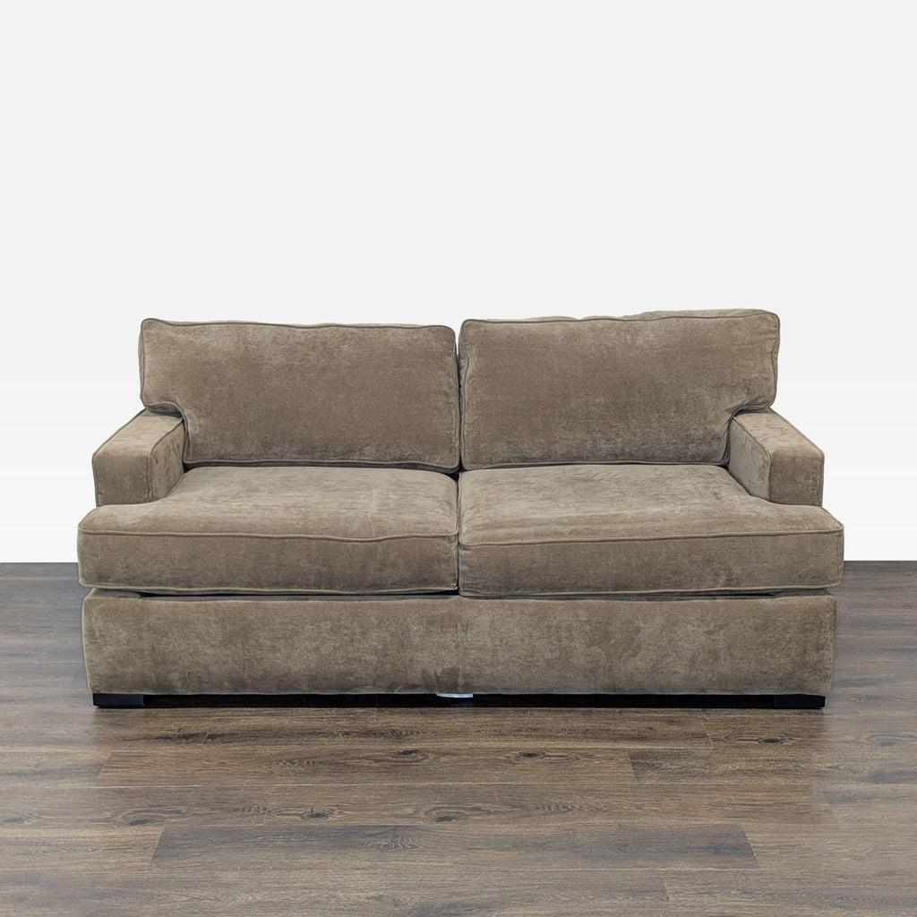 3. Front view of a Reperch brand sleeper sofa with two large seat cushions and a neutral color.