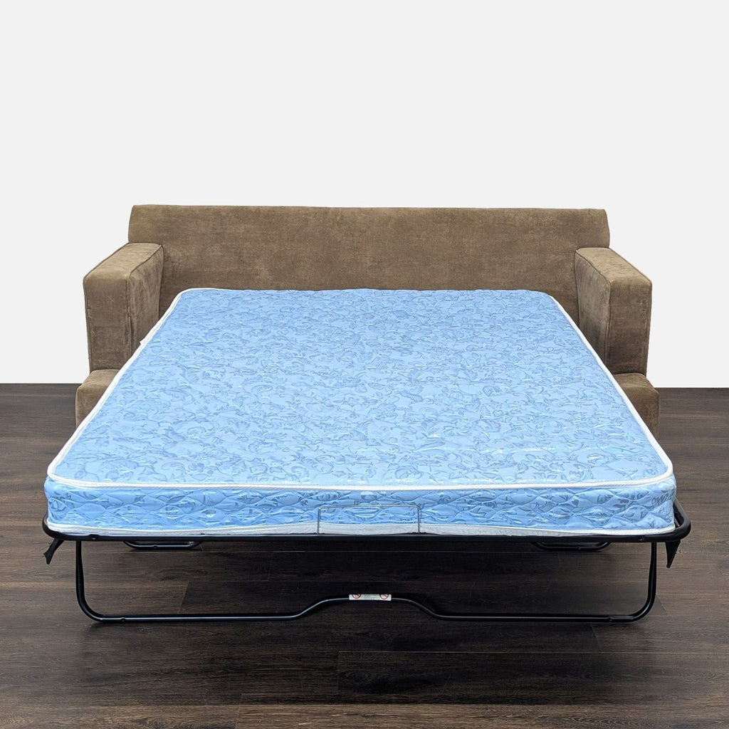 2. Reperch sleeper sofa opened with a blue mattress visible, ready for use as a bed.  